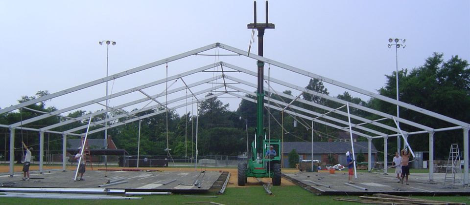 Erecting tents at US golf open, USA, 23 yrs old